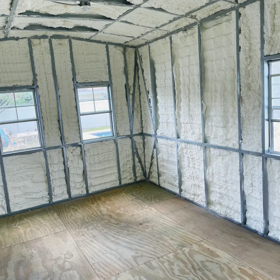 Closed-cell spray foam insulation applied to wall cavities in a residential project in Hilton